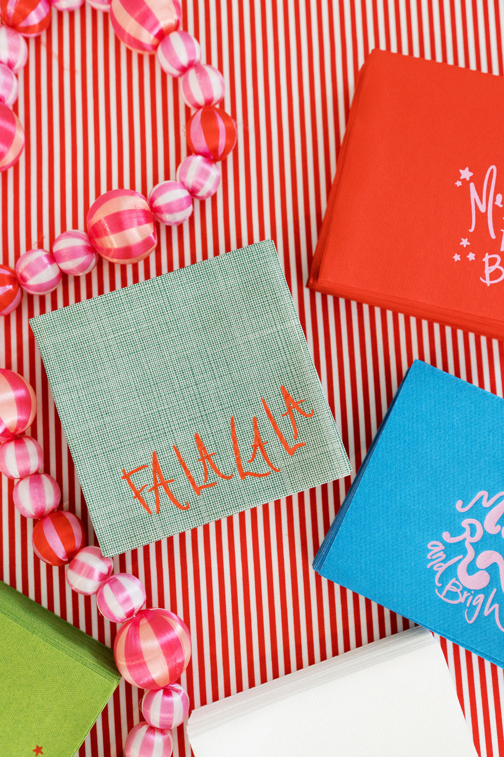 Fa la la la Textured Paper Linen Napkins in Green + Red